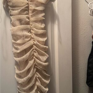 Size large, more like a rose gold glittery dress